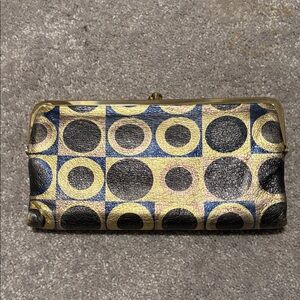 HOBO Circle Pattern Clutch in Black, Gold, and Blue